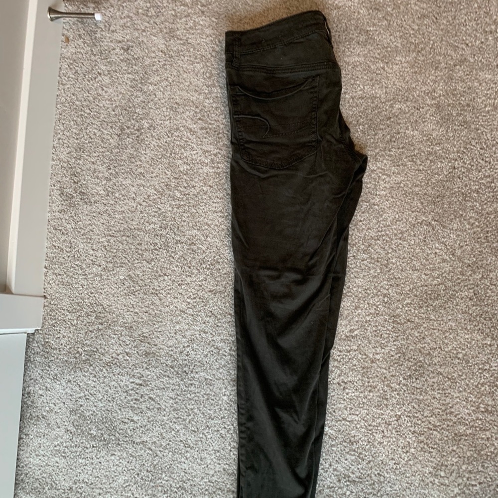 Very dark green jeans